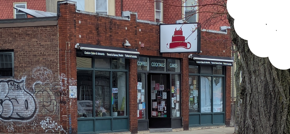 The front of Sin Bakery, taken at an angle. There is a bite out of the top right-hand corner of the image